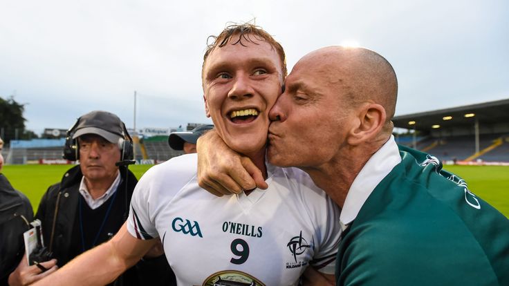 Kildare's Paul Cribbin(left) is congratulated by a supporter after his side's shock victory over Cork