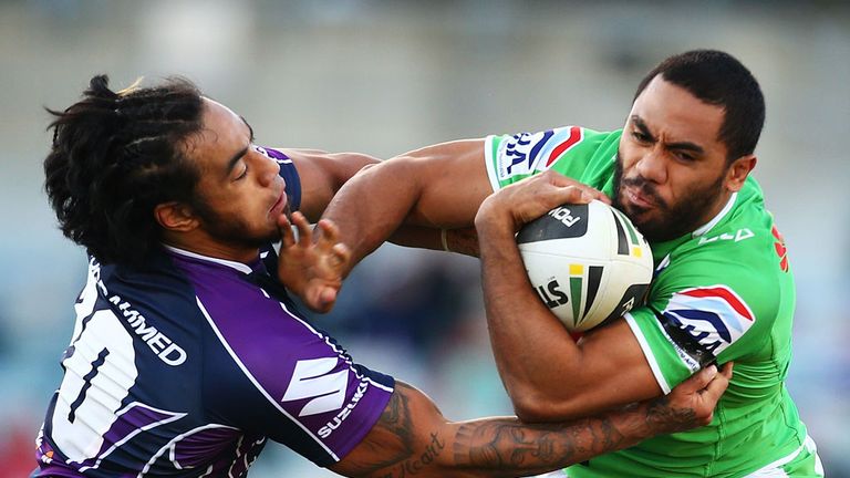 Bill Tupou right is tackled playing for Canberra Raiders in an NRL match against Melbourne Storm. Photo by Mark Nolan/Getty Images