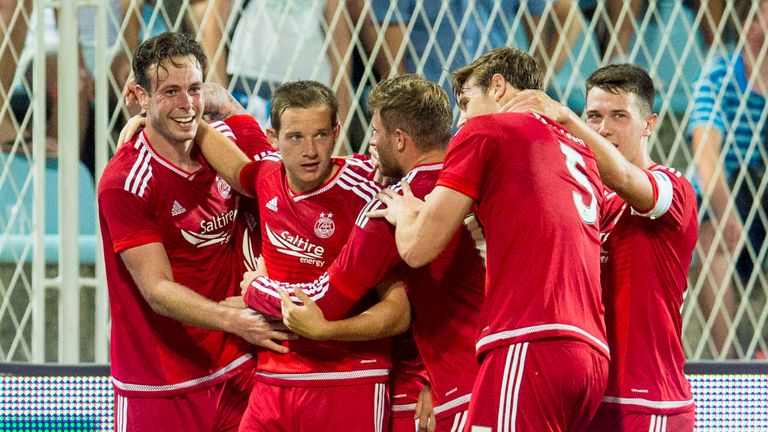 Aberdeen's Andrew Considine (left) celebrates after putting his side 1-0 up in Croatia