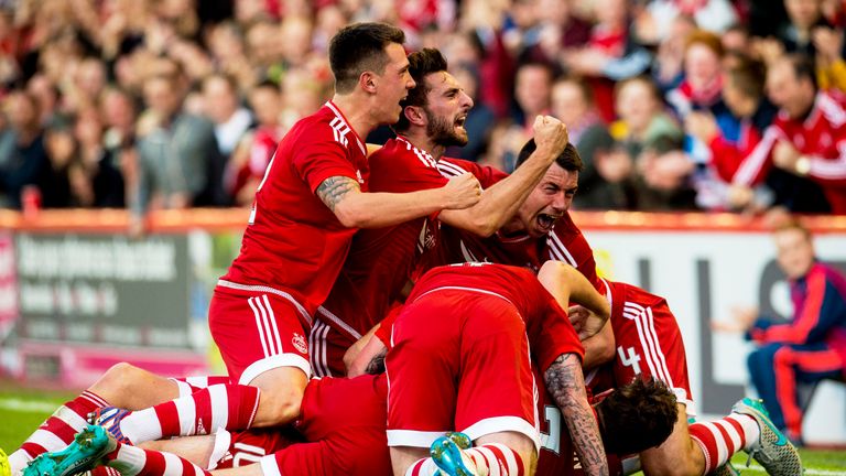 Aberdeen, pictured celebrating Niall McGinn's goal, came back from the brink of an embarrassing collapse to advance in the Europa League against Rijeka