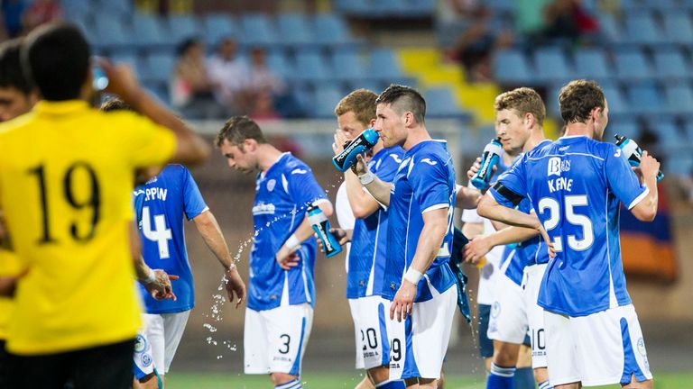 St Johnstone's players take on water in the hot conditions