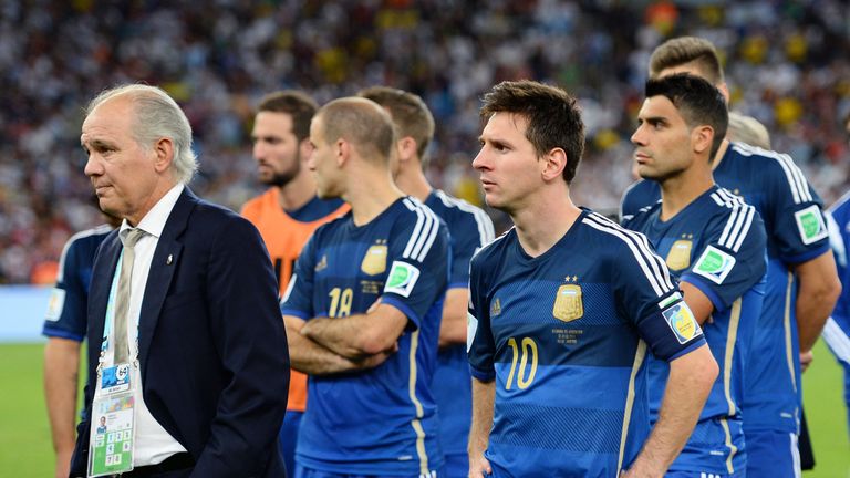 Head coach Alejandro Sabella of Argentina looks on with Lionel Messi after being defeated by Germany 1-0 in extra time of the 2014 World Cup final