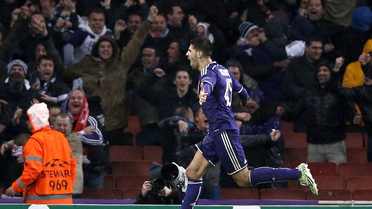 Aleksandar Mitrovic celebrates scoring his team's third goal against Arsenal in the Champions League.