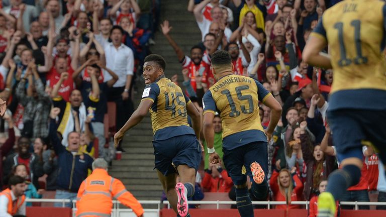 Alex Iwobi celebrates scoring a goal for Arsenal during the match between Arsenal and Olympic Lyon at Emirates Stadium on July 25, 2015