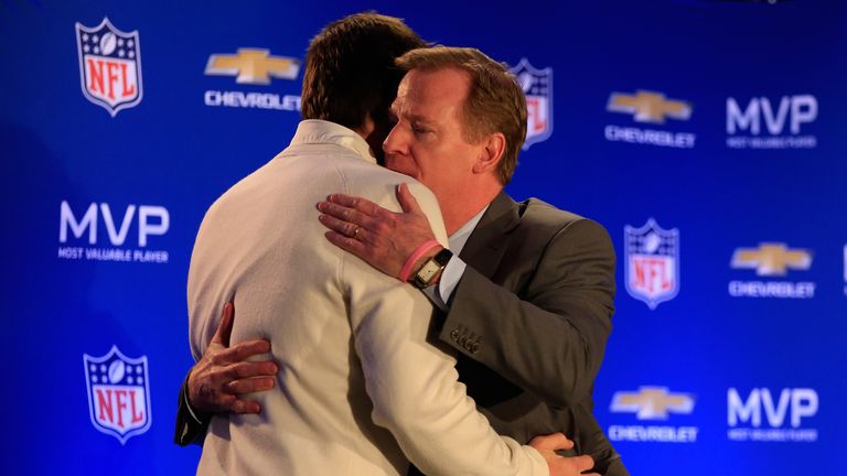 Tom Brady  hugs NFL Commissioner Roger Goodell after receiving his Super Bowl XLIX MVP award.