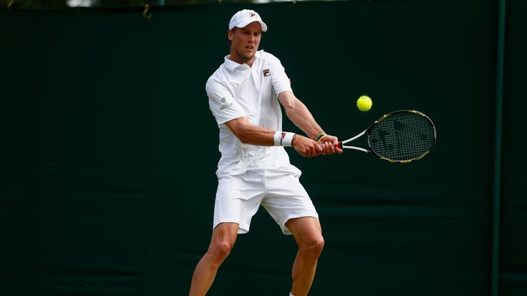 Andreas Seppi of Italy plays a backhand in his Gentlemens Singles Second Round match against Borna Coric at Wimbledon