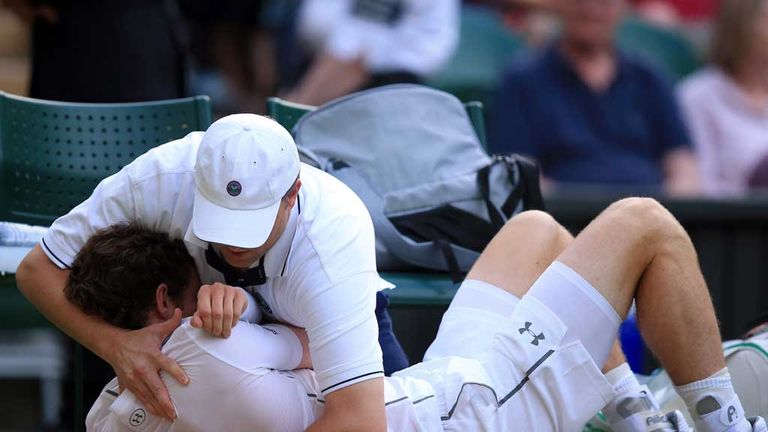 Andy Murray receives treatment during his match against Andreas Seppi at Wimbledon