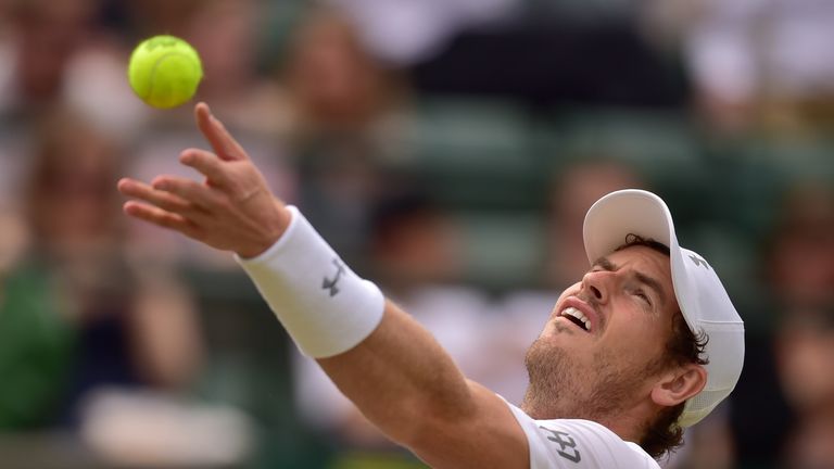 Britain's Andy Murray serves against Netherlands' Robin Haase at Wimbledon