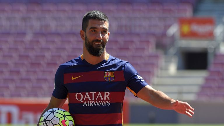 Barcelona's new player Arda Turan gestures during his official presentation at the Camp Nou stadium in Barcelona