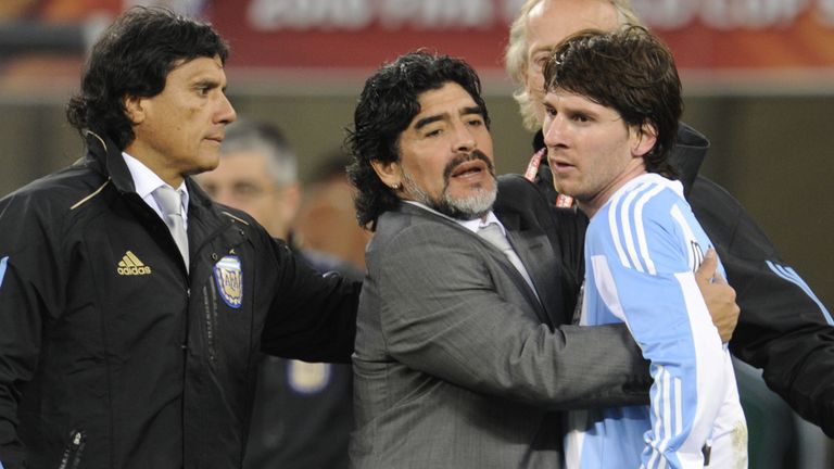 Argentina's coach Diego Maradona hugs Argentina's striker Lionel Messi after the 2010 World Cup quarter final Argentina vs Germany on July 3, 2010