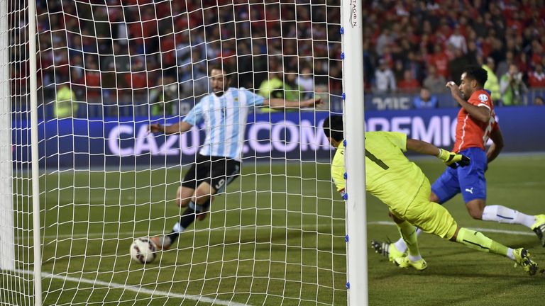 Argentina's Gonzalo Higuain misses a clear chance in injury time