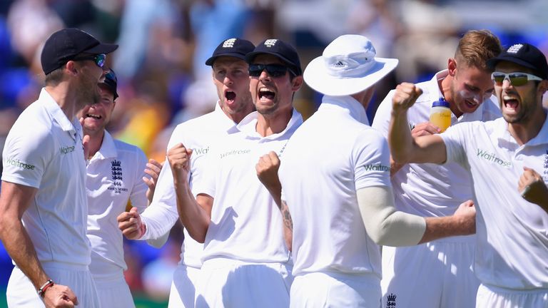 England captain Alastair Cook and team-mates celebrate after Stuart Broad had dismissed Shane Watson 