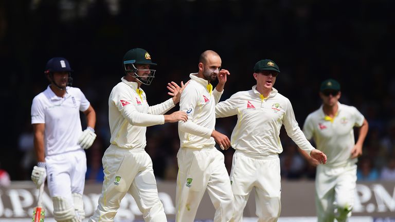 Nathan Lyon celebrates with team-mates after taking the wicket of Jos Buttler of England during day the second Ashes Test