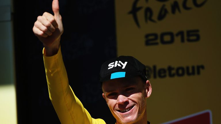 Chris Froome of Great Britain and Team SKY celebrates after retaining his overall leaders yellow jersey
