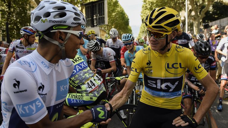 Colombia's Nairo Quintana (L), wearing the best young's white jersey, shakes hands with Great Britain's Christopher Froome