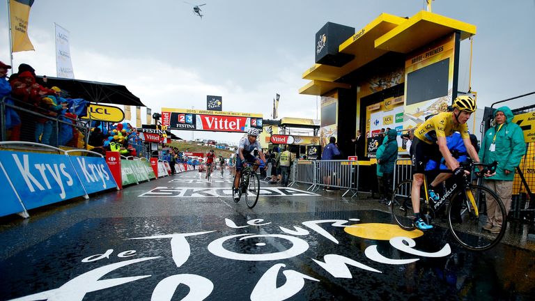 PLATEAU DE BEILLE, FRANCE - JULY 16:  Chris Froome of Great Britain and Team Sky crosses the finish line ahead of Nairo Alexander Quintana 