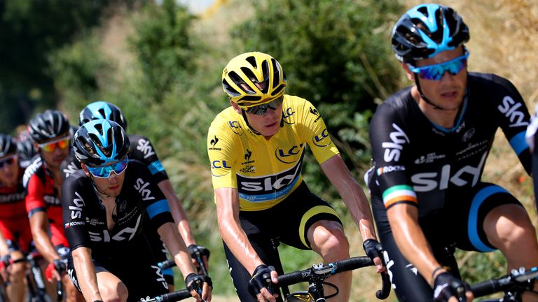 Chris Froome of Great Britain and Team Sky rides in between Nicolas Roche of Ireland and Team Sky and Leopold Konig of the Czech 
