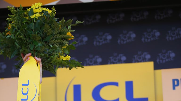 Chris Froome celebrates after taking the yellow jersey on stage three of the Tour de France