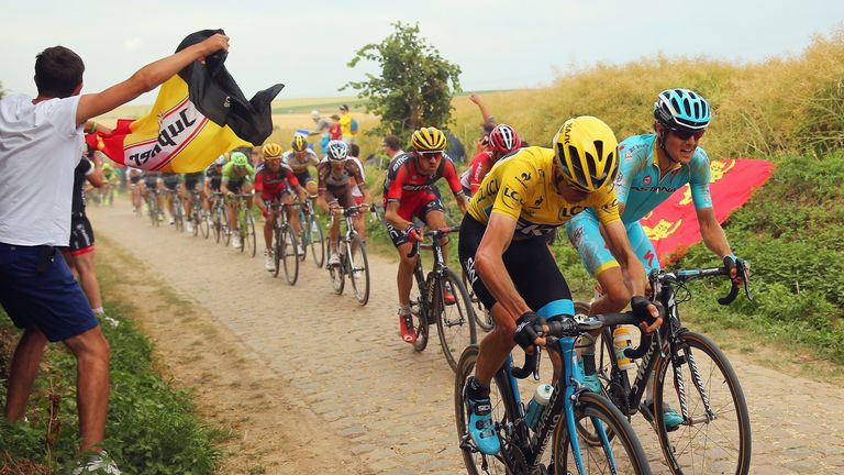 CAMBRAI, FRANCE - JULY 07:  Yellow jersey wearer Chris Froome of Great Britain and Team Sky rides along last secteur of cobbles during stage four of the 20