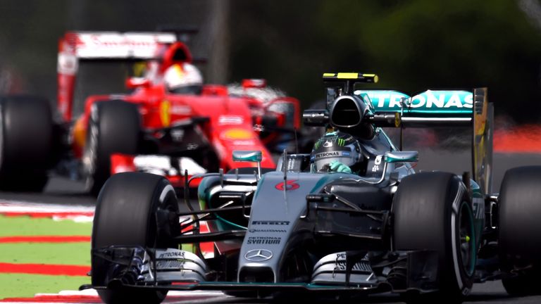 Sebastian Vettel follows Nico Rosberg during Friday practice for the British GP