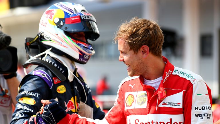 Red Bull's Daniel Ricciardo and Ferrari's Sebastian Vettel embrace in parc ferme