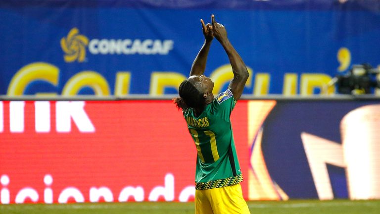Darren Mattocks celebrates scoring the opening goal for Jamaica against the United States in the Gold Cup
