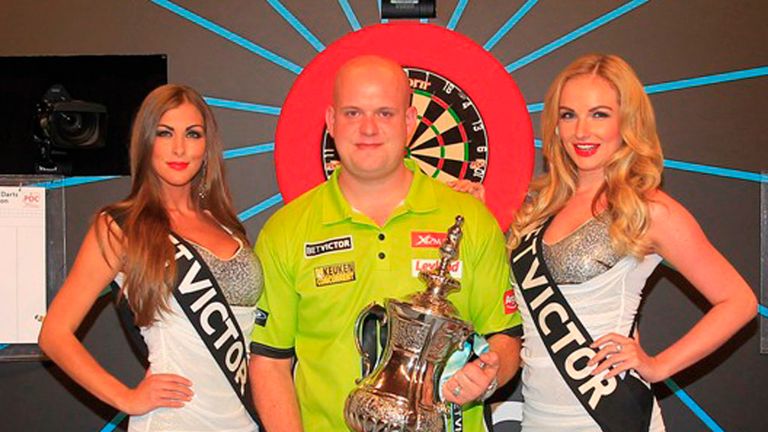 Michael van Gerwen with the World Matchplay trophy (picture: Lawrence Lustig)