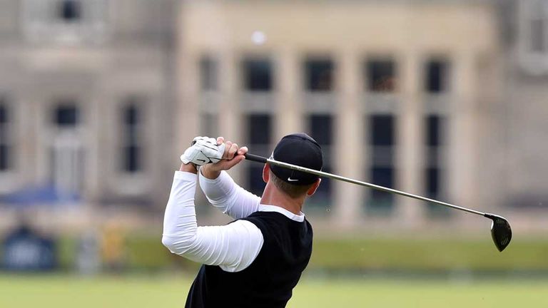 David Duval launches his tee shot at the 18th during the third round of the 144th Open 