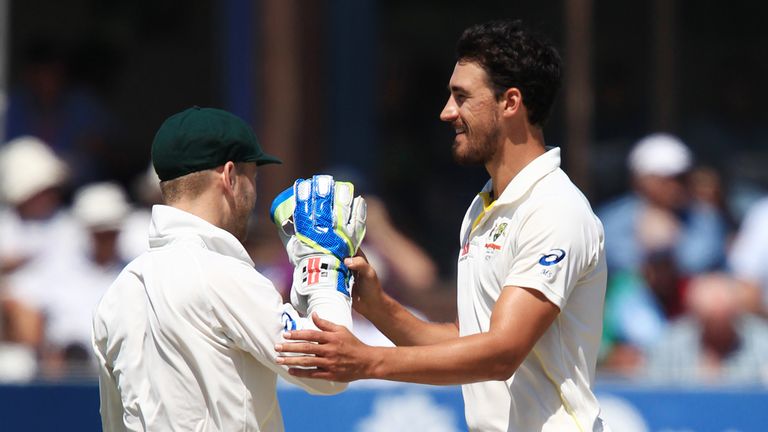 Australia's Mitchell Starc celebrates with wicketkeeper Peter Nevill (left) after taking wicket of Essex batsman Jesse Ryder