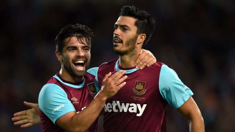West Ham United's James Tomkins (right) celebrates scoring his teams opening goal with team mate Mauro Zarate