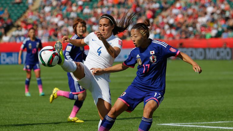 Fara Williams of England battles Yuki Ogimi of Japan at the Women's World Cup