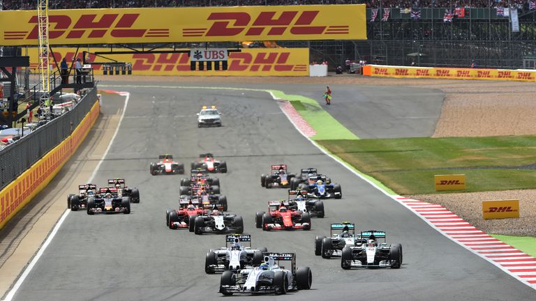 Massa sweeps past the Mercedes' at the start of the British GP