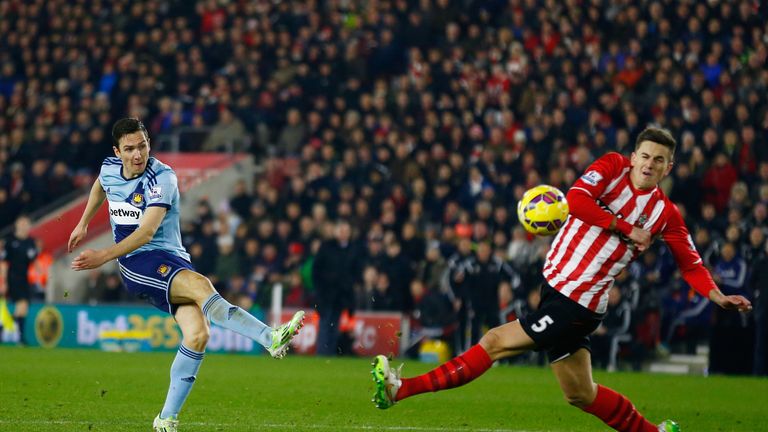 SOUTHAMPTON, ENGLAND - FEBRUARY 11:  Stewart Downing of West Ham shoots at goal past Florin Gardos of Southampton during the Barclays Premier League match 