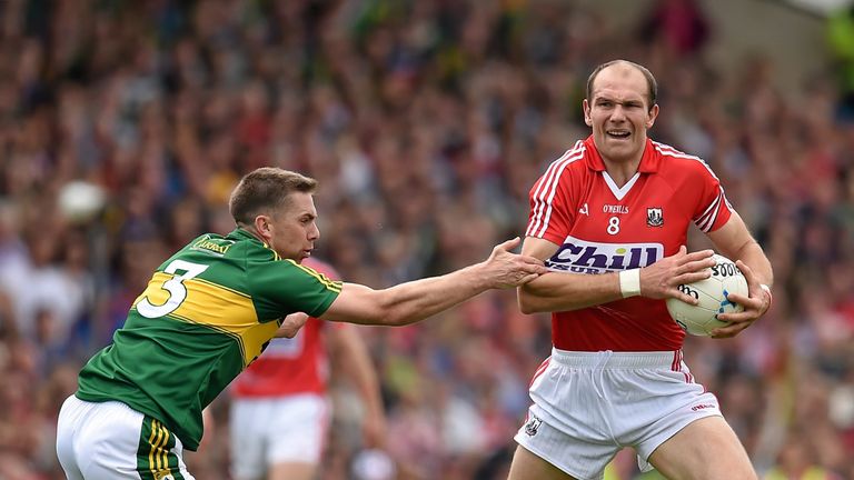 Alan O'Connor is tackled by Marc Ó Sé during Sunday's drawn Munster final