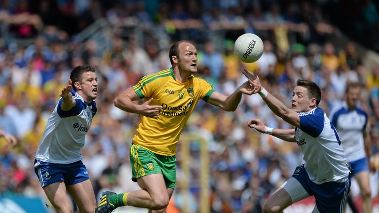 Donegal forward Colm McFadden (middle) is challenged by Ryan Wylie and Conor McManus
