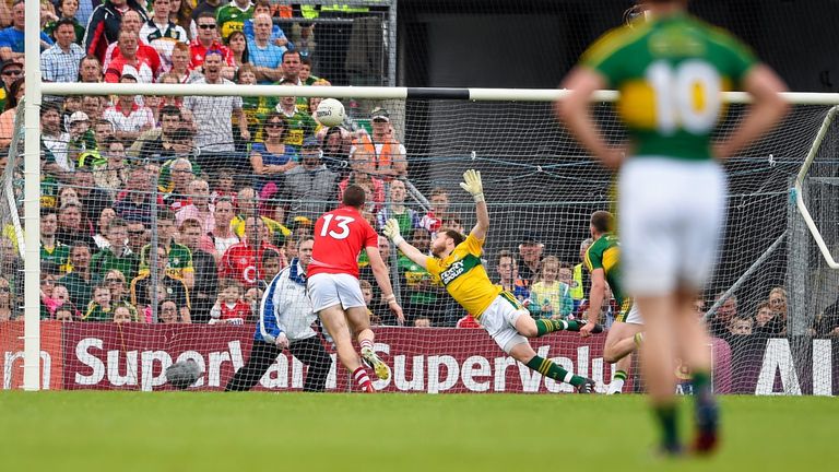Colm O'Neill fists past Kerry goalkeeper Brendan Kealy to score Cork's first goal