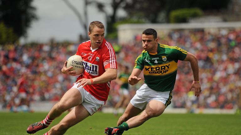 Cork forward Colm O'Neill is tracked by Shane Enright of Kerry