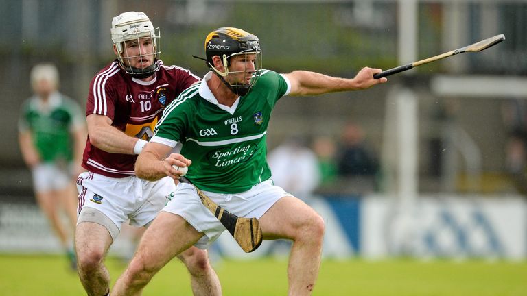 Limerick midfielder James Ryan is challenged by Alan Devine of Westmeath