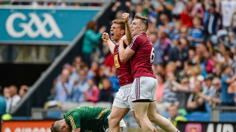 John Heslin and Kieran Martin celebrate after Heslin scored Westmeath's third goal against Meath