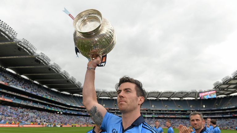 Dublin's Michael Darragh Macauley celebrates with the Delaney Cup