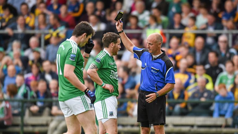 Niall Cassidy, Fermamagh, is shown a black card by referee Cormac Reilly