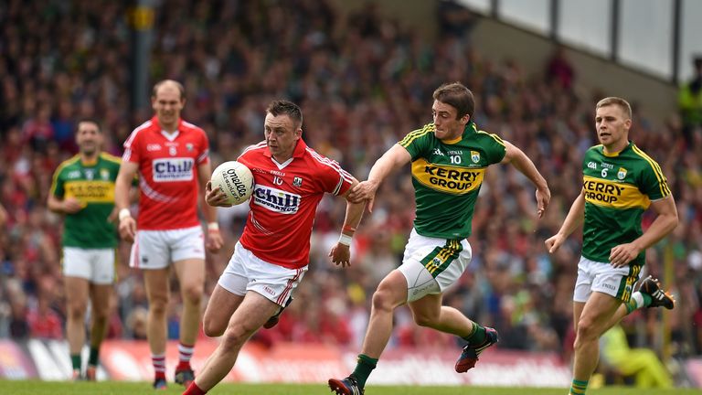 Paul Kerrigan, Cork, in action against Stephen O'Brien, Kerry