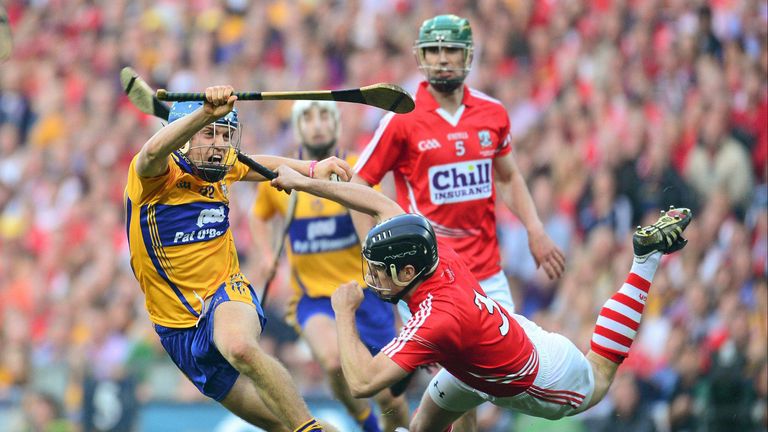 Shane O'Donnell, pictured evading Shane O'Neill, scored 3-3 in Clare's All-Ireland final replay win over Cork in 2013