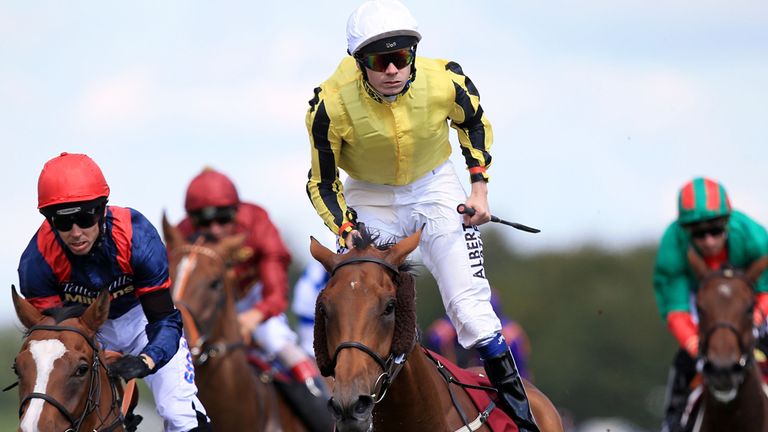 Jamie Spencer celebrates after riding Big Orange to victory in the Goodwood Cup at Glorious Goodwood
