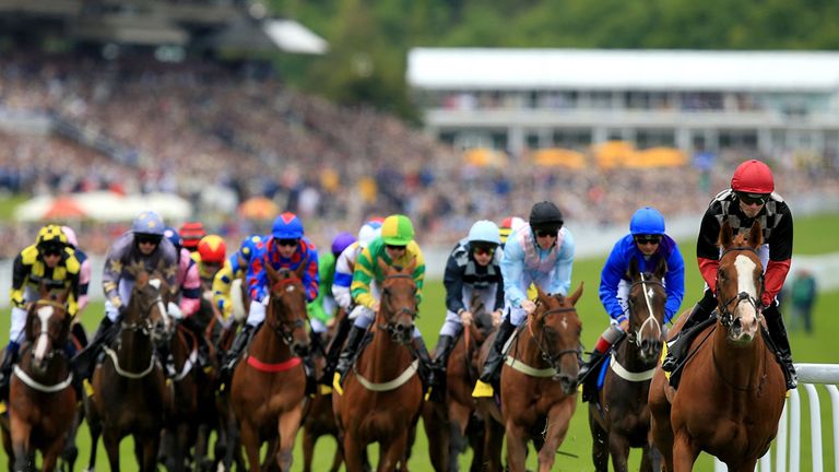 Sands Of Fortune, ridden by William Twiston-Davies, leads the field on his way to victory in the opening race on day two at Glorious Goodwood
