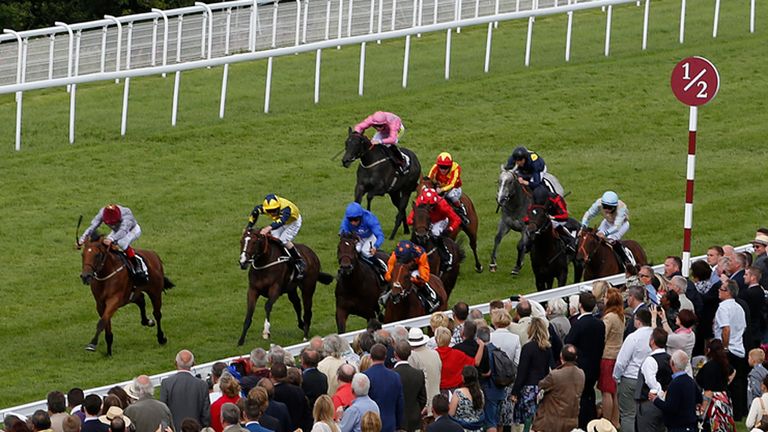 CHICHESTER, ENGLAND - JULY 29: Richard Kingscote riding Kachy (R, orange sleeves) win The Fairmont Molecombe Stakes at Goodwood racecourse on July 29, 2015