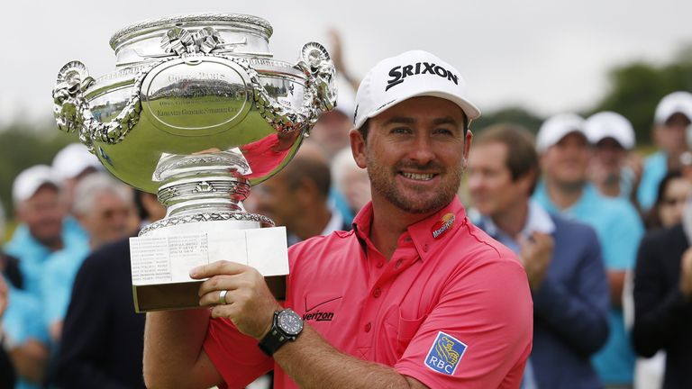 Graeme McDowell poses with his trophy after winning the 2014 Alstom Open de France on July 6, 2014 at Le Golf National.
