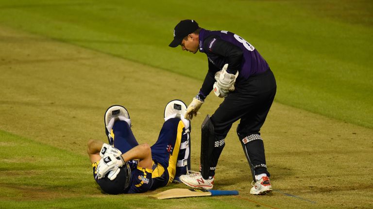 Geraint Jones shows concern after Glamorgan batsman Graham Wagg is hit by a ball on the helmet during the NatWest T20 Blast game with Gloucestershire