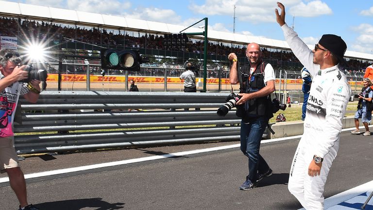 Lewis Hamilton celebrates his pole position at Silverstone