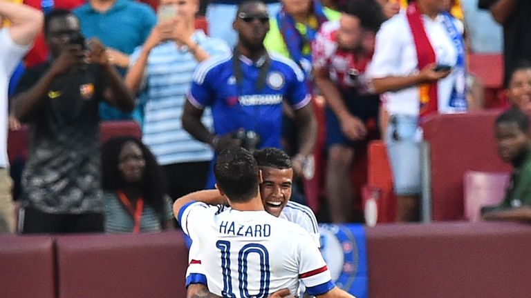 Eden Hazard celebrates with Kenedy after scoring against Barcelona